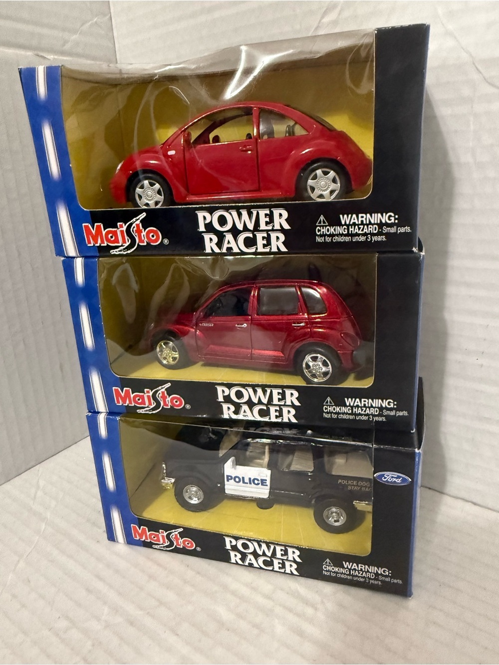 Lot 3 Maisto Die Cast Power Racer Volkswagen,
Police Car and GT Cruiser NEW